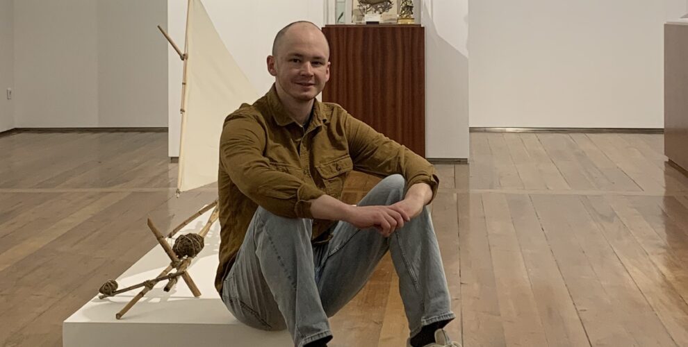 SiPN alumnus and Fulbright researcher Champ Turner standing inside his exhibition "Out of the Ashes" at the Carlos Machado Museum in São Miguel, Azores.